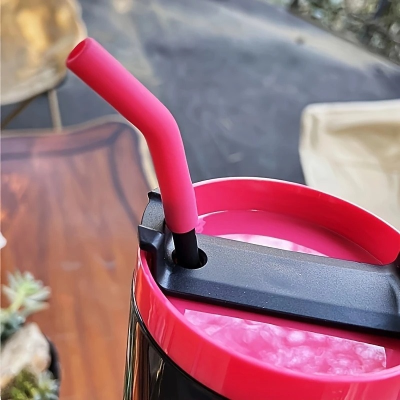 Close-up of the leak-proof pink lid and flexible silicone straw of an original product insulated water bottle.