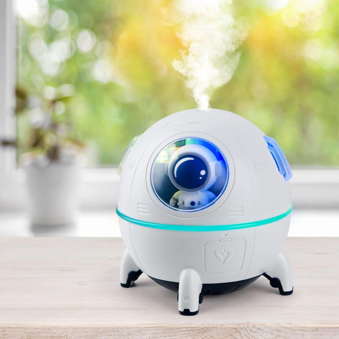 An Astronaut Spaceship Humidifier original product placed on a wooden desk for home office decor.
